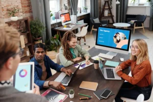 Team of diverse professionals in a modern Toronto office discussing accounting and finance recruitment strategies — IPG Workforce Solutions, employers page hero image.