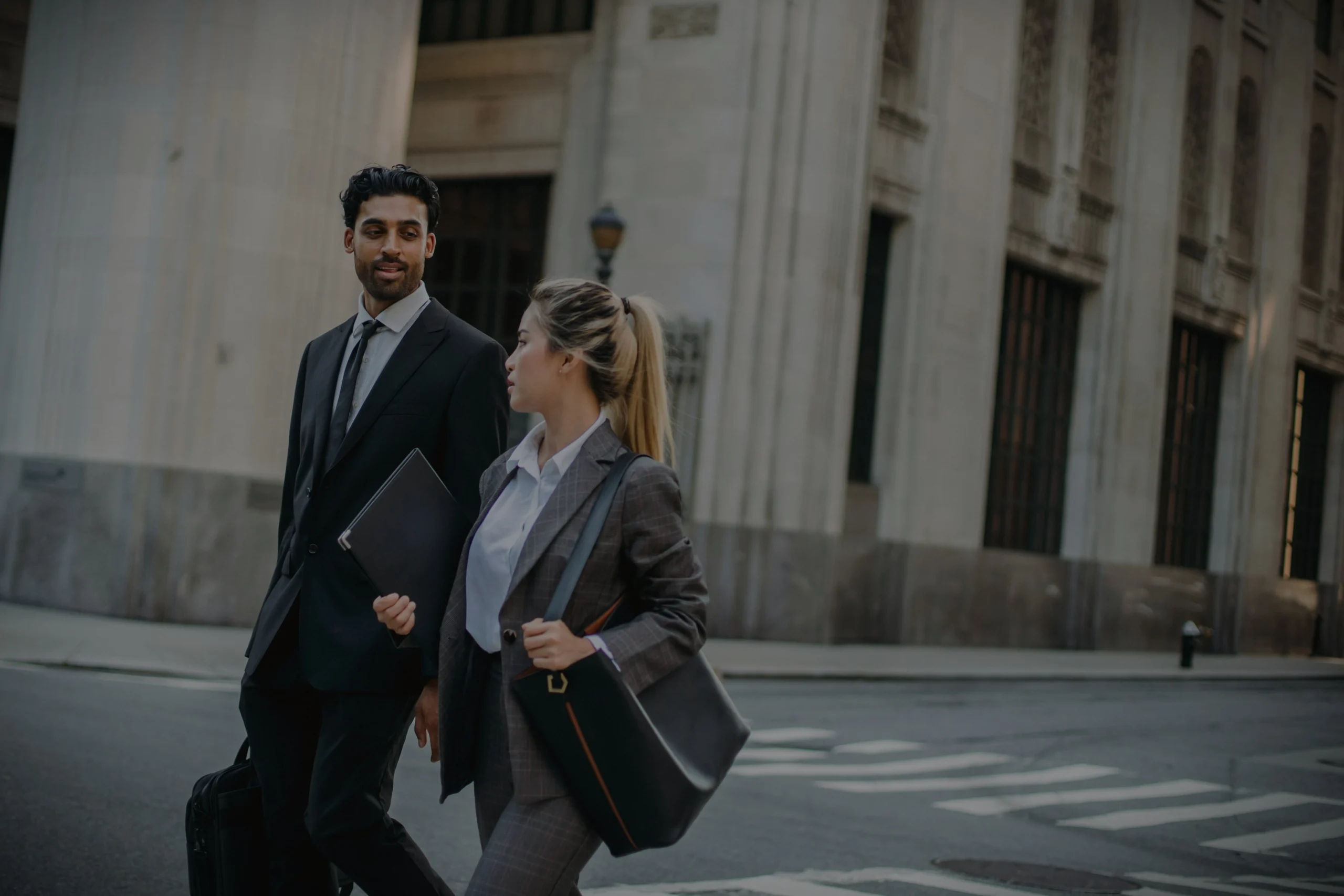 Finance and accounting professionals in Toronto walking outside corporate offices